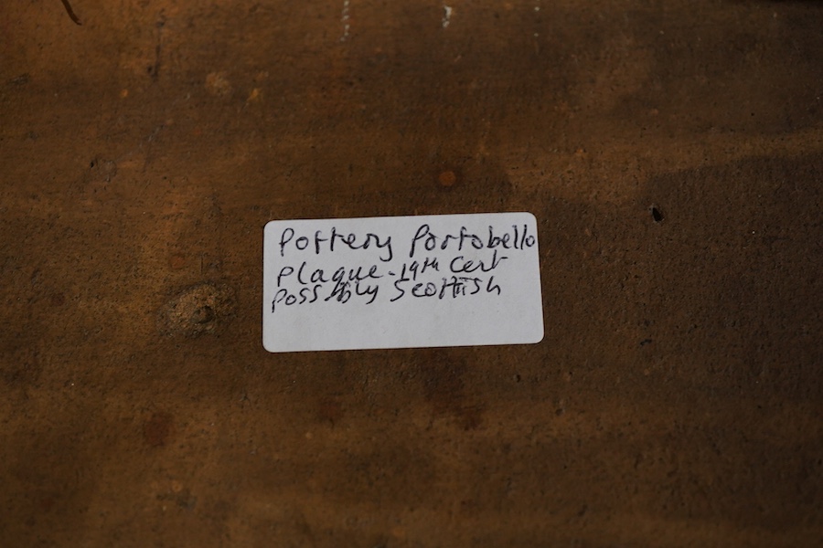 The Law Suit, a Scottish portobello terracotta plaque, 19 x 30cm